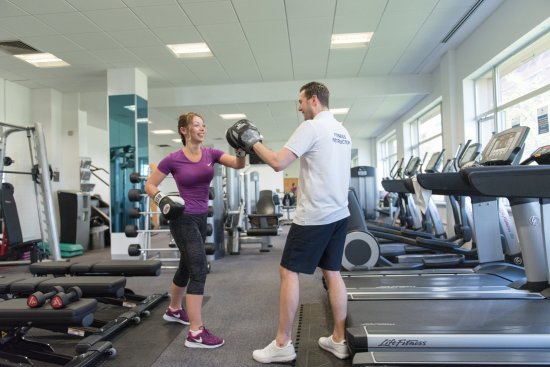 man and woman in gym