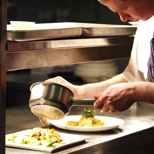 Chef plating up food